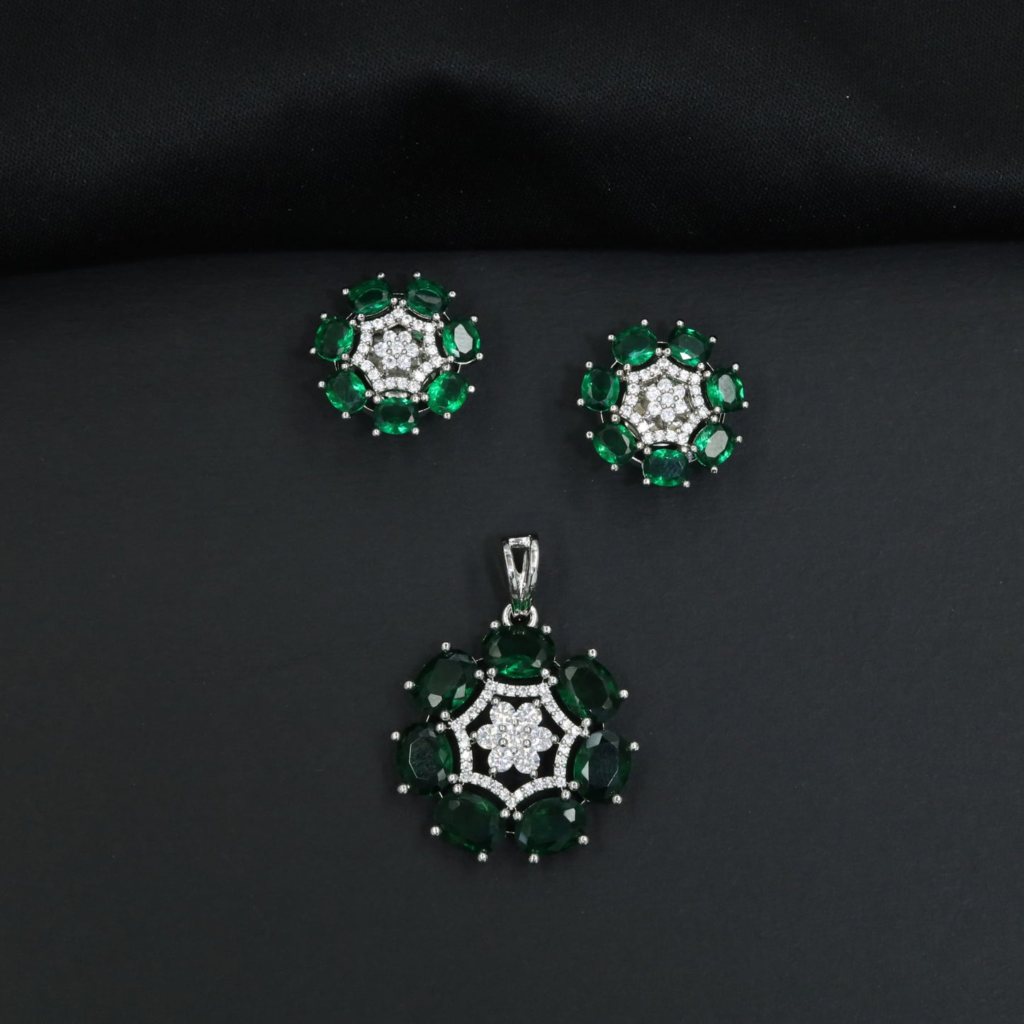 Statement floral pendant set featuring a flower bloom centerpiece and circular petal arrangement