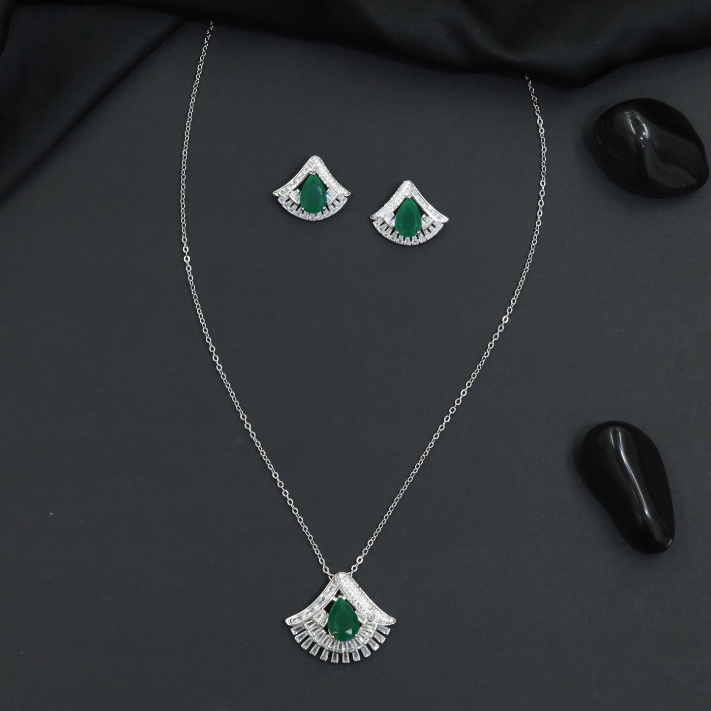 Designer chain with pendant showcasing a fan-inspired silhouette and geometric border detailing