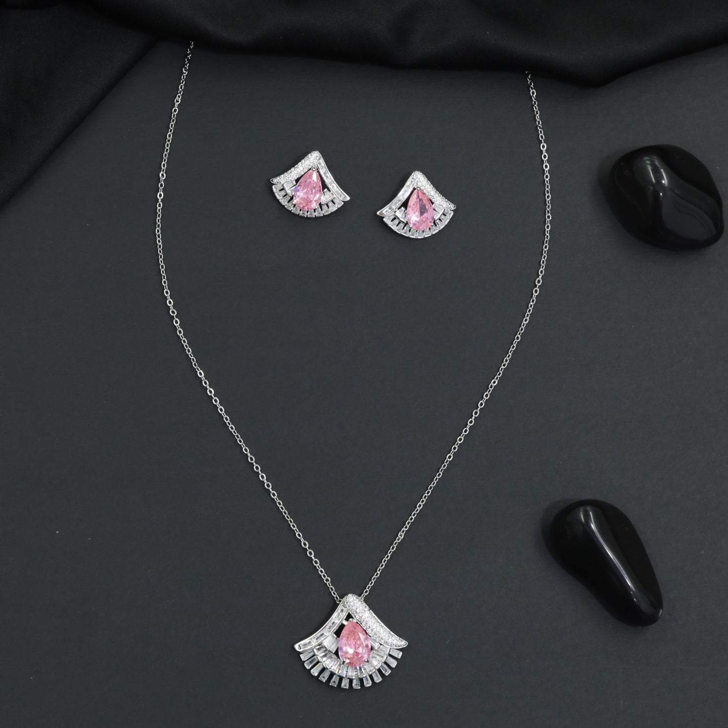 Designer chain with pendant showcasing a fan-inspired silhouette and geometric border detailing