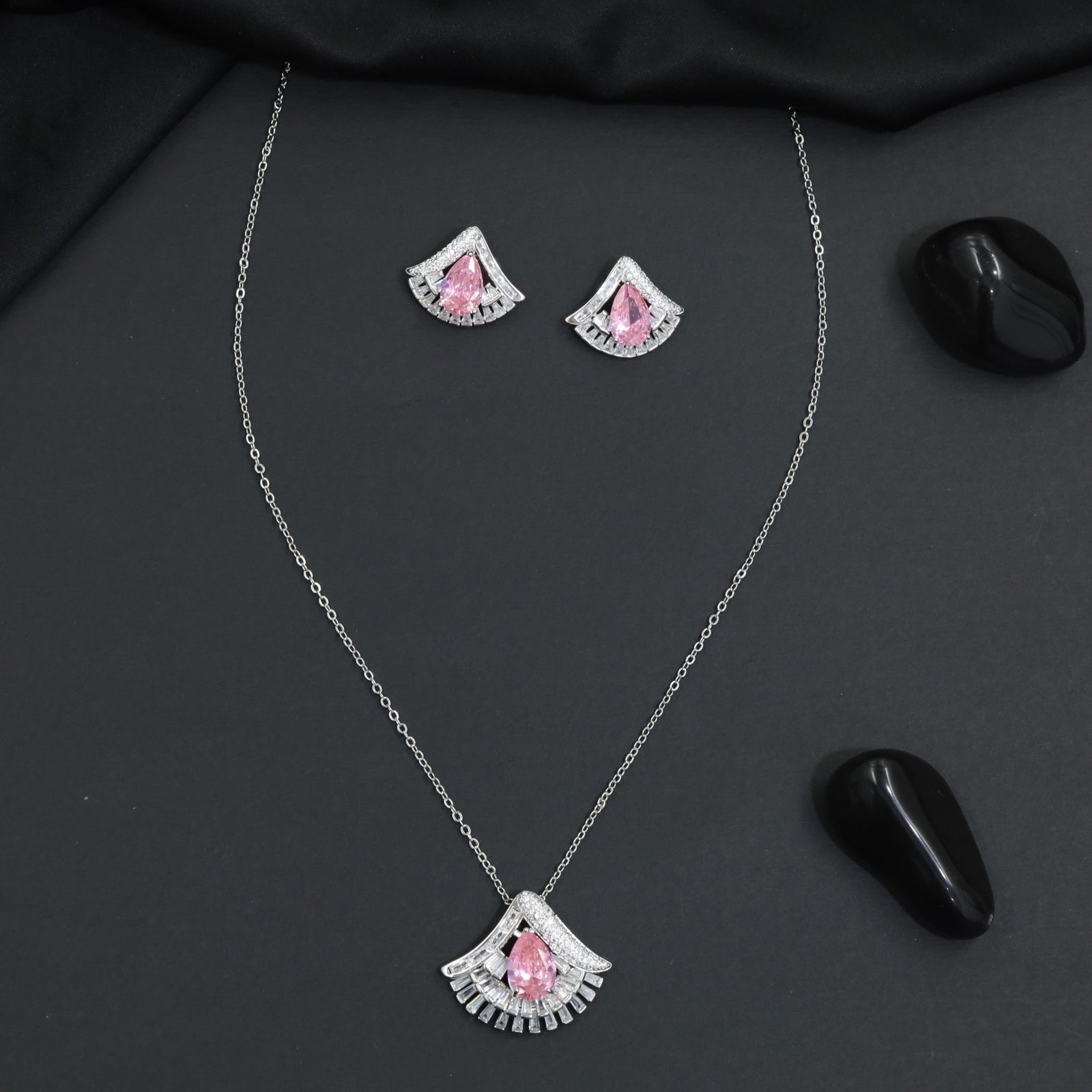 Designer chain with pendant showcasing a fan-inspired silhouette and geometric border detailing