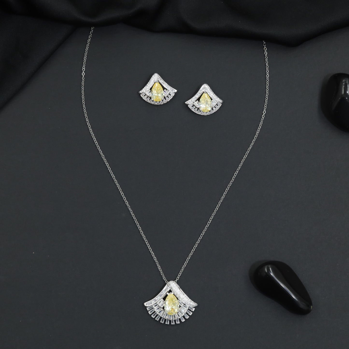 Designer chain with pendant showcasing a fan-inspired silhouette and geometric border detailing