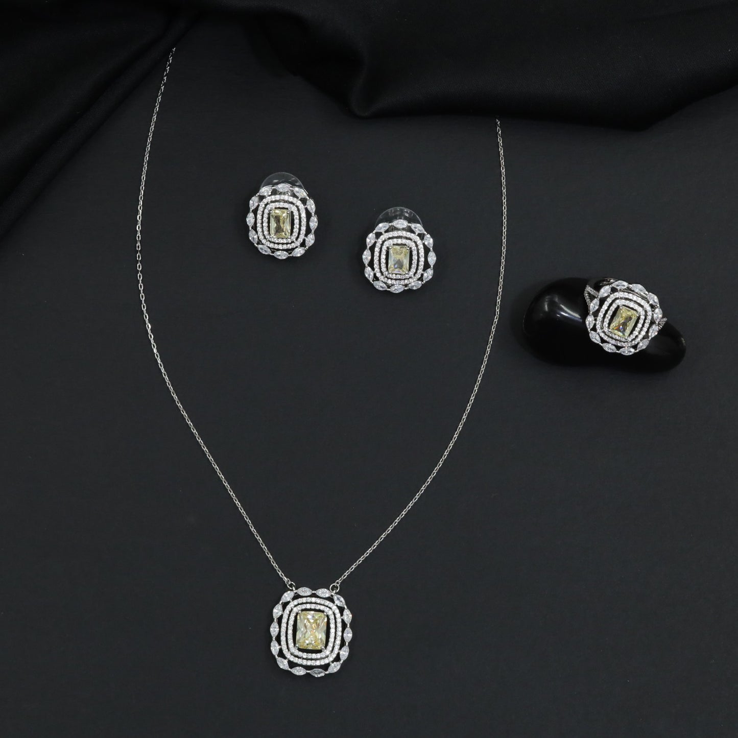 Statement pendant chain set with structured geometric detailing and matching studs