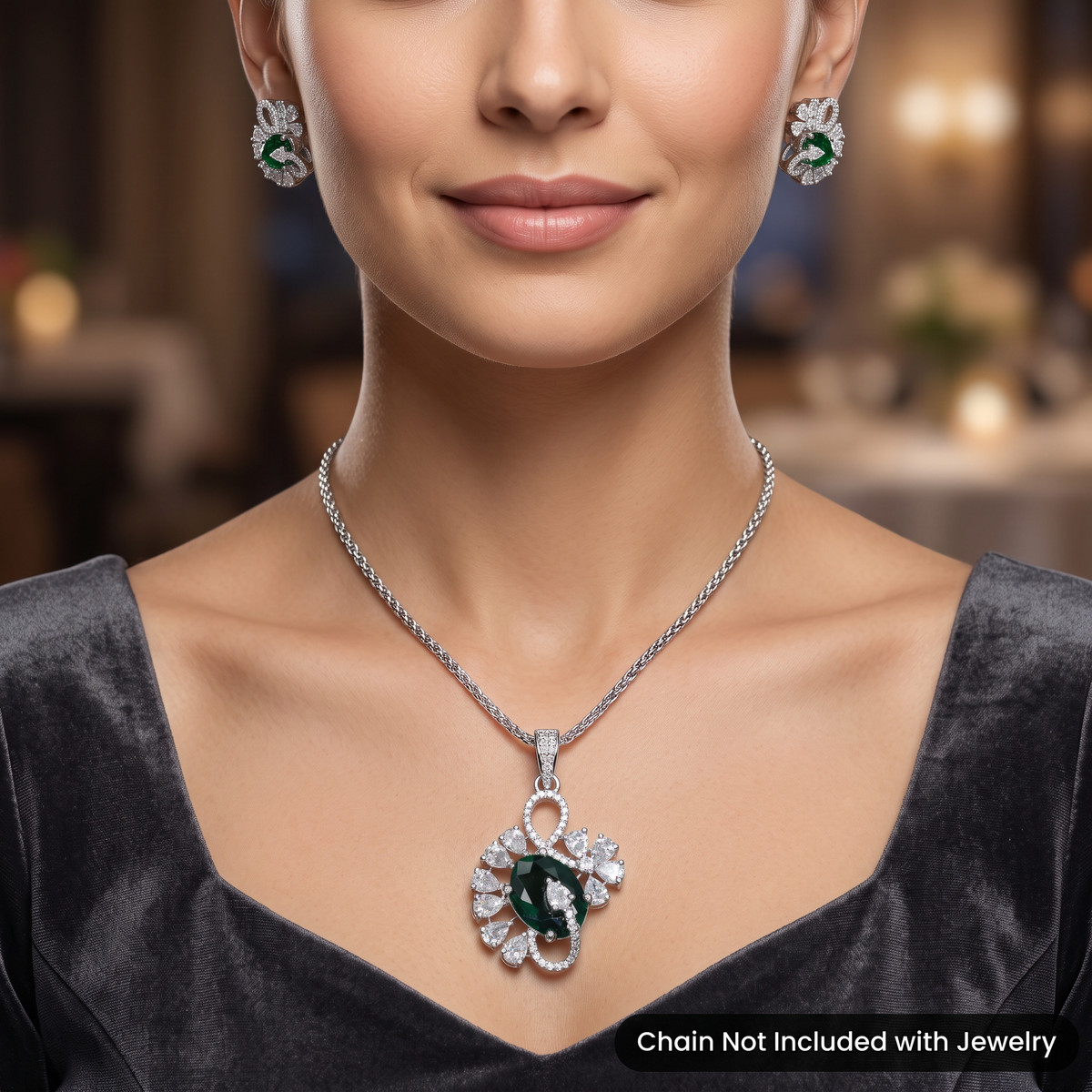 Floral swirl pendant set with leaf cluster detailing and matching stud earrings