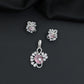 Floral swirl pendant set with leaf cluster detailing and matching stud earrings