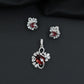 Floral swirl pendant set with leaf cluster detailing and matching stud earrings