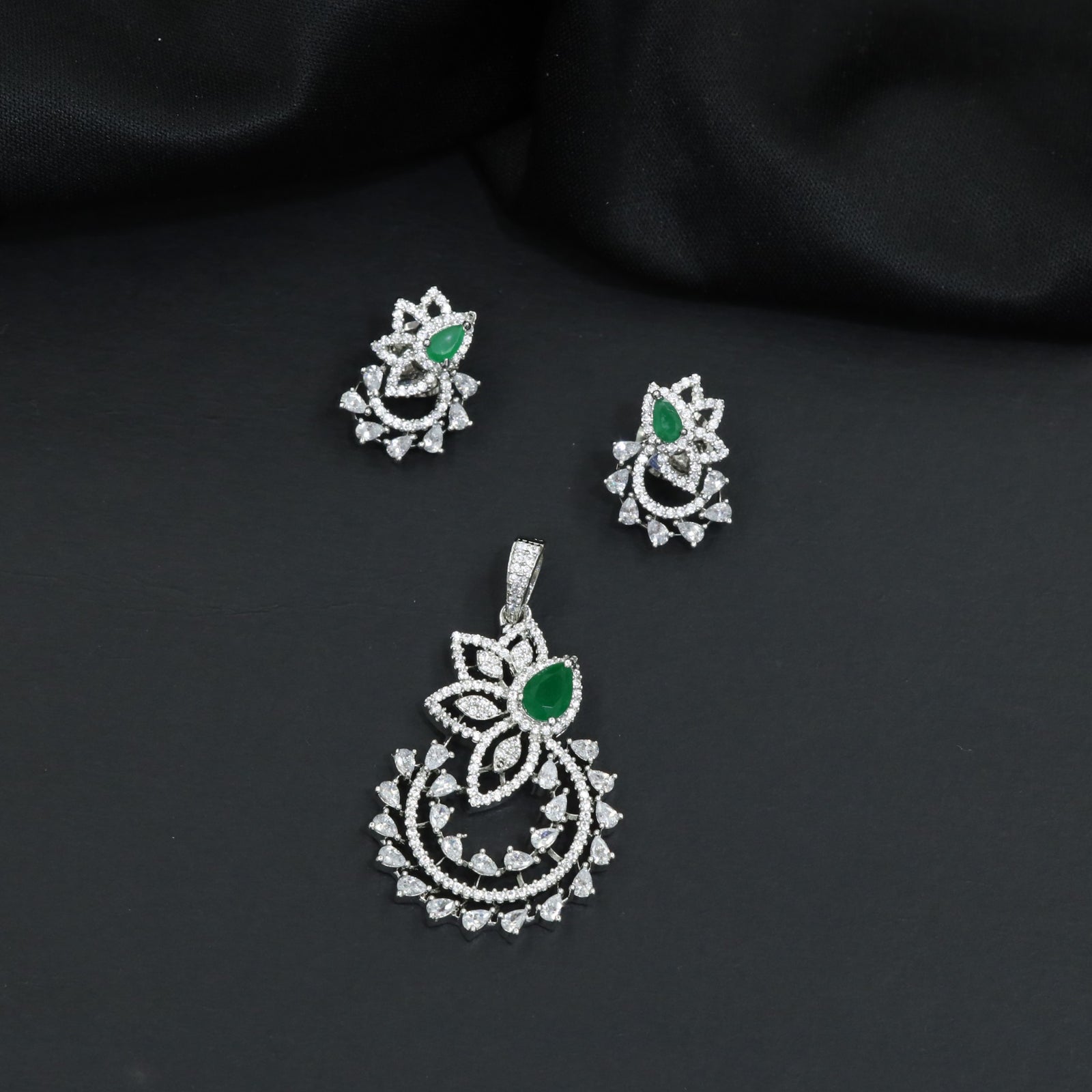 Designer pendant set showcasing a flower silhouette with cascading leaf accents