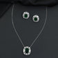 Contemporary pendant chain set with a structured medallion profile and matching stud earrings