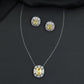 Contemporary pendant chain set with a structured medallion profile and matching stud earrings