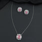 Contemporary pendant chain set with a structured medallion profile and matching stud earrings