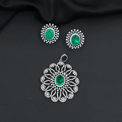 Grand flower pendant set featuring an oval centerpiece and scalloped petal arrangement