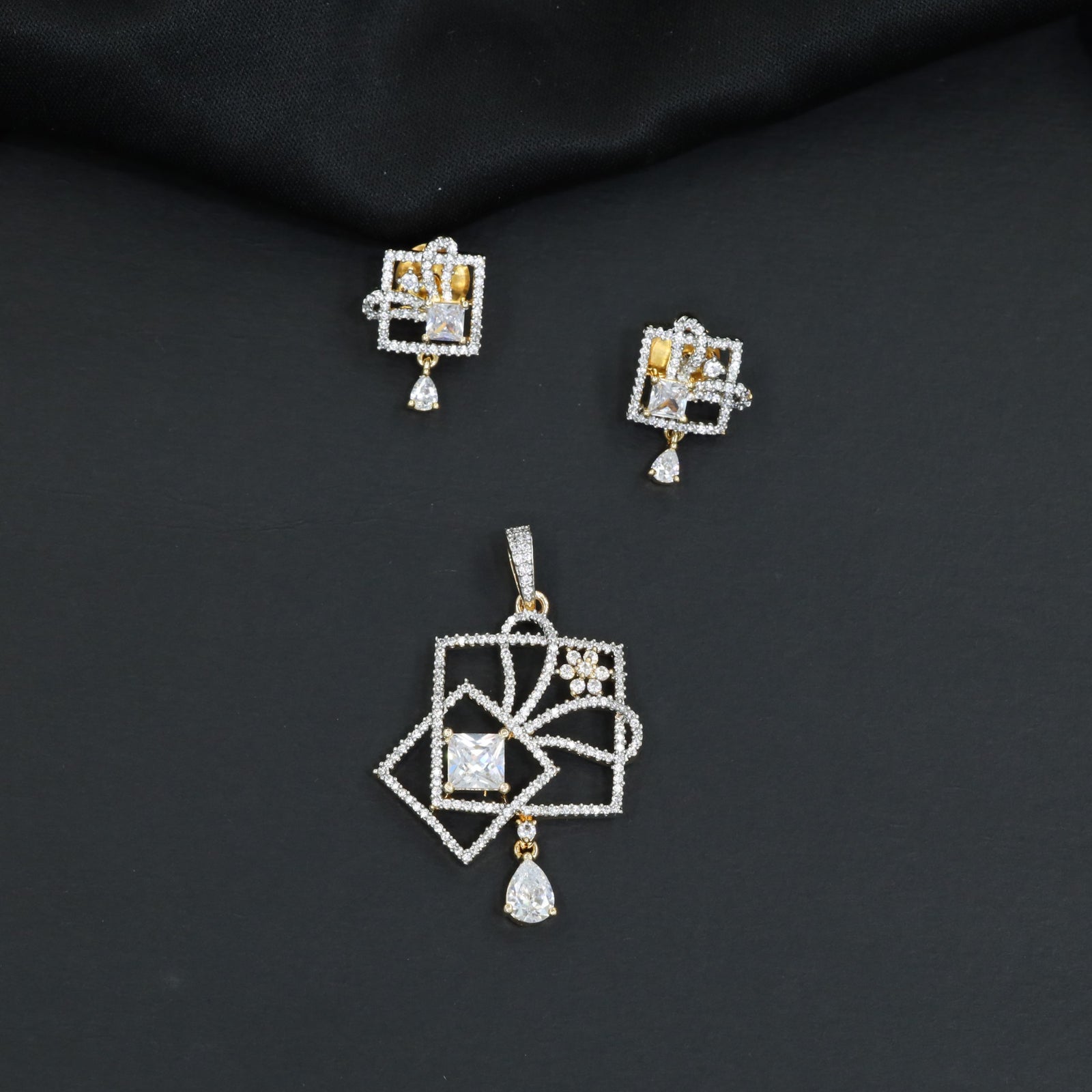 Contemporary square frame pendant set with flowing swirl construction