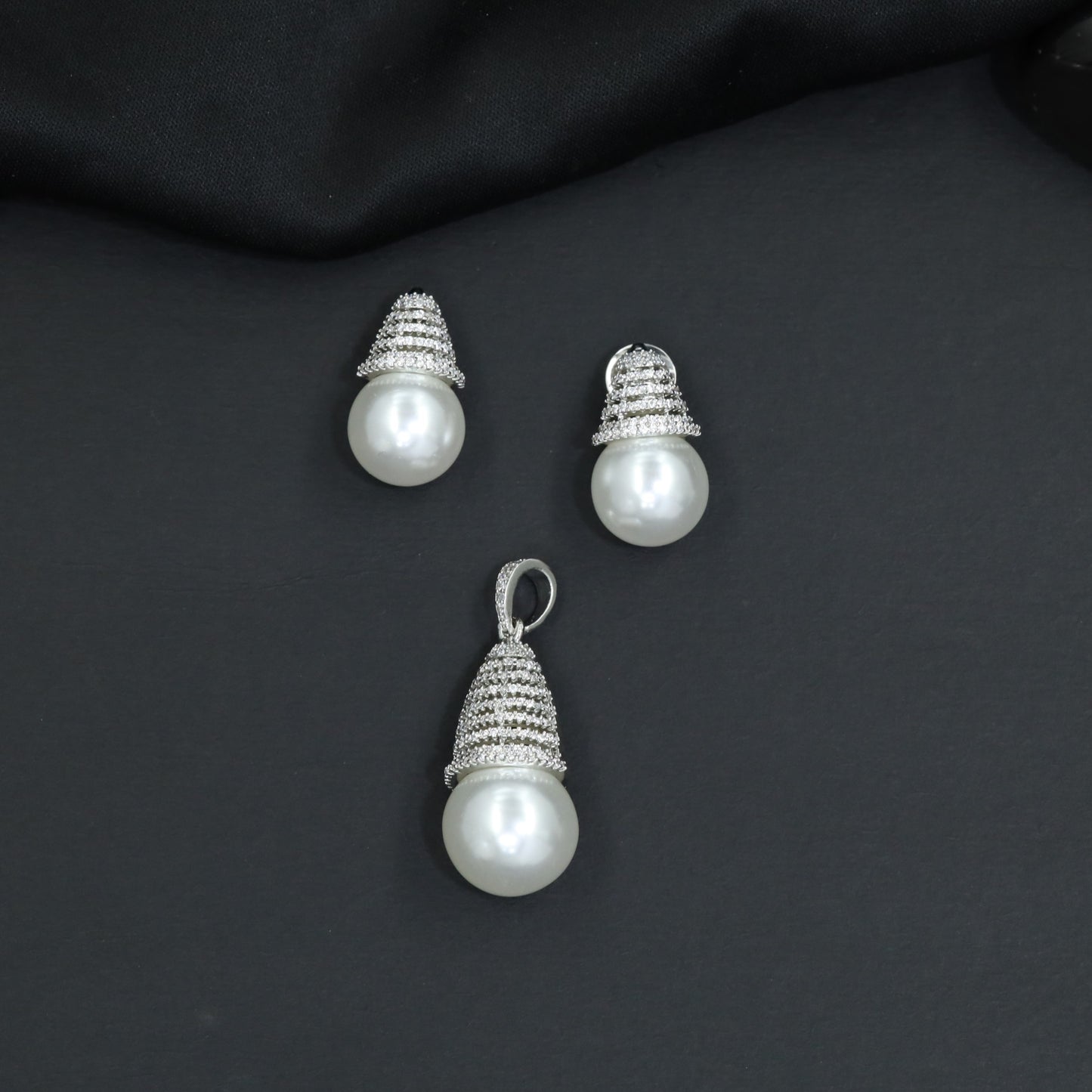 Dome cap pendant set with pearl drop centerpiece and matching stud earrings