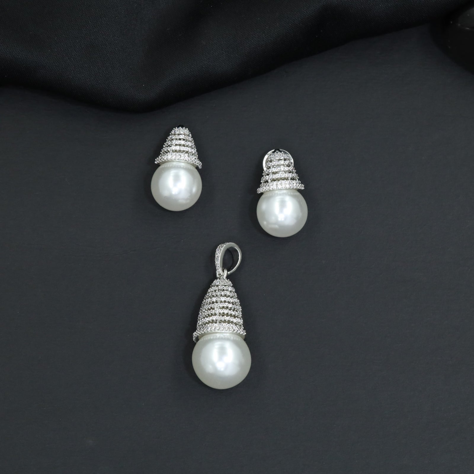 Dome cap pendant set with pearl drop centerpiece and matching stud earrings