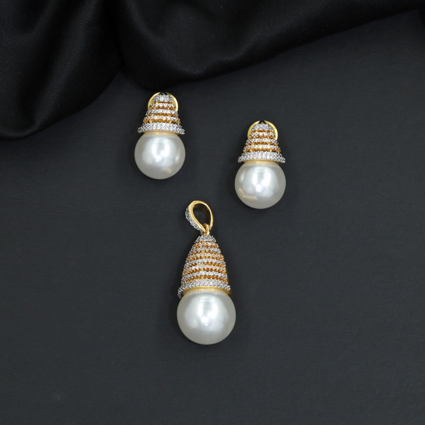 Dome cap pendant set with pearl drop centerpiece and matching stud earrings