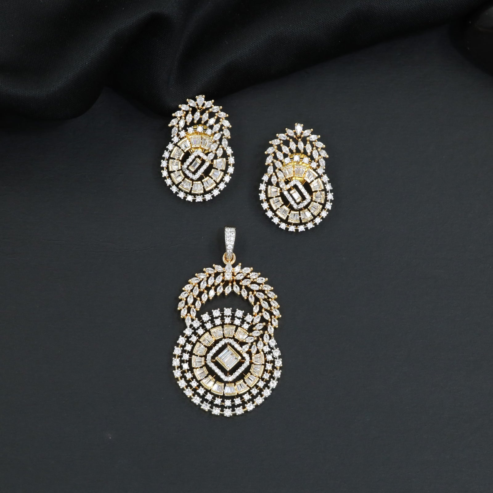 Floral halo pendant set with concentric circular detailing and matching earrings
