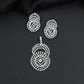 Floral halo pendant set with concentric circular detailing and matching earrings