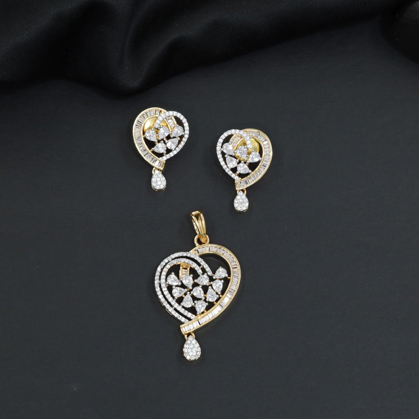 Contemporary heart pendant set with flower cluster construction and hanging drops