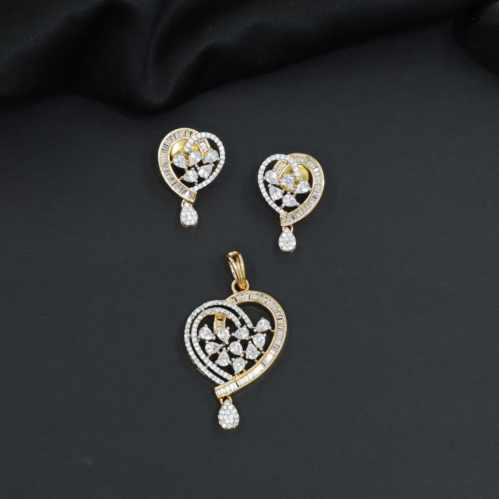 Contemporary heart pendant set with flower cluster construction and hanging drops