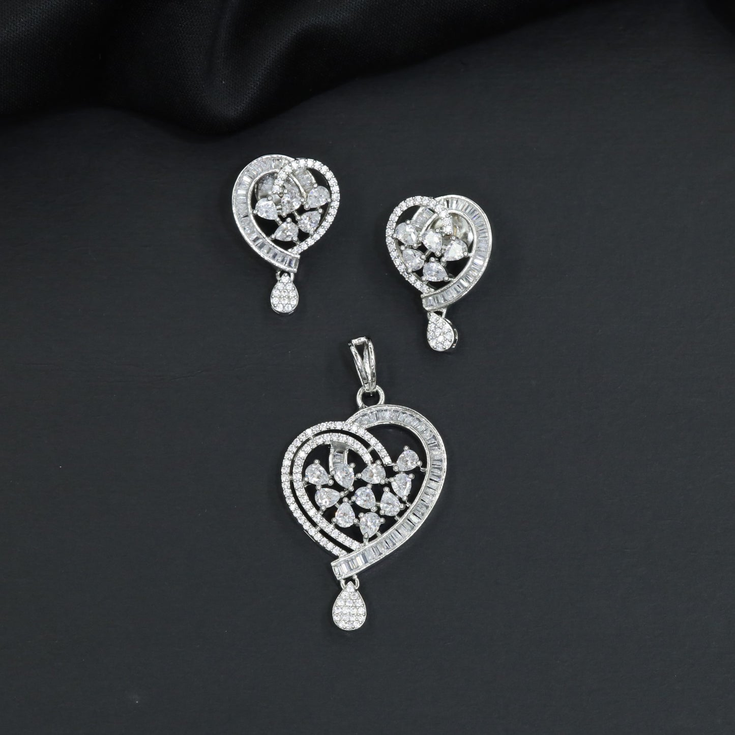 Contemporary heart pendant set with flower cluster construction and hanging drops