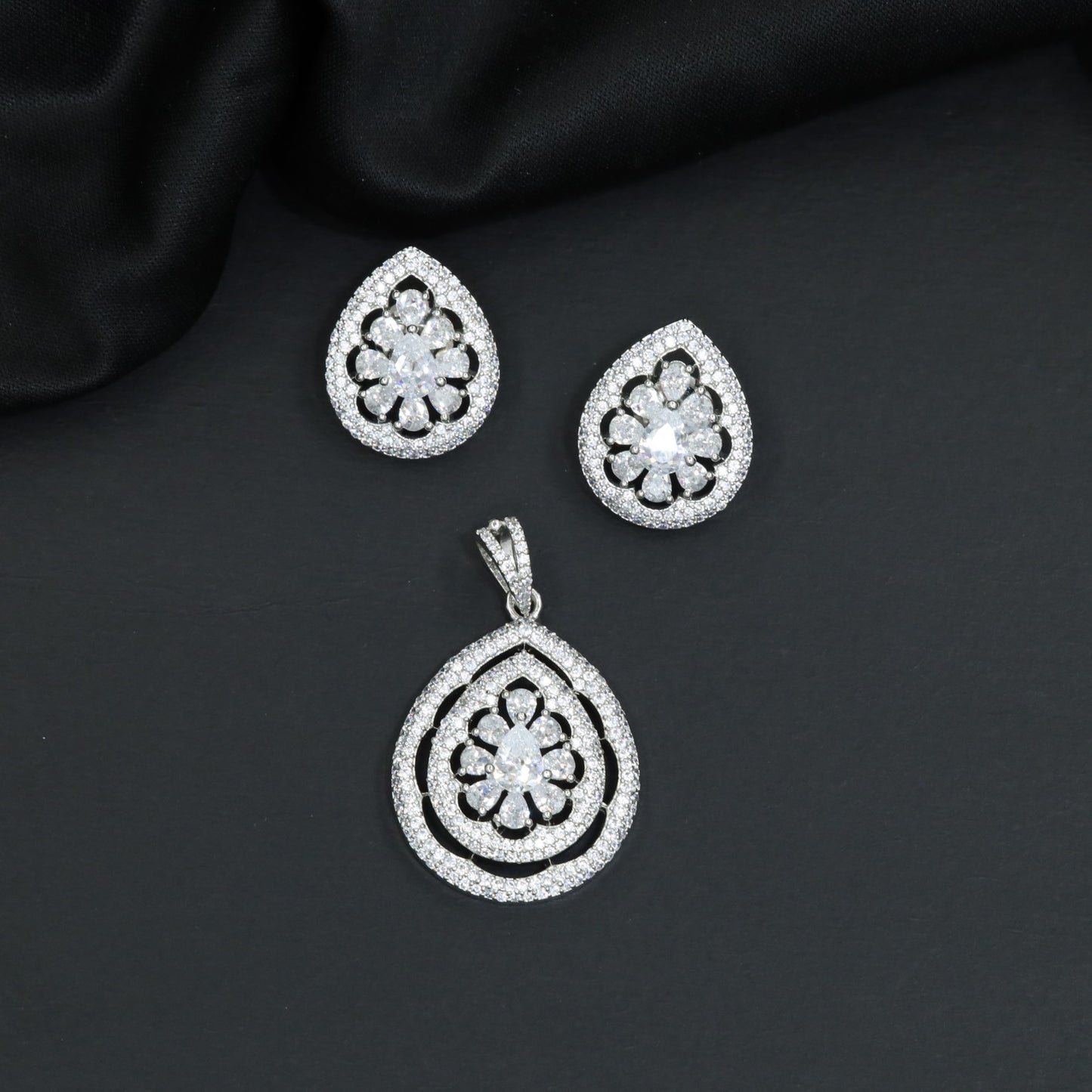 Teardrop floral pendant set with openwork petal frame and matching earrings