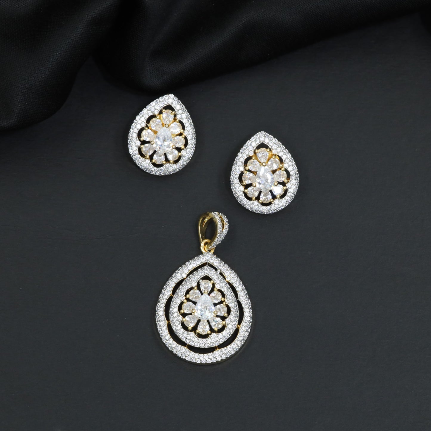 Teardrop floral pendant set with openwork petal frame and matching earrings