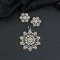 Mandala-inspired pendant set with intricate openwork pattern and floral accents
