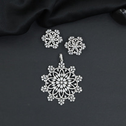 Mandala-inspired pendant set with intricate openwork pattern and floral accents