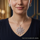 Mandala-inspired pendant set with intricate openwork pattern and floral accents