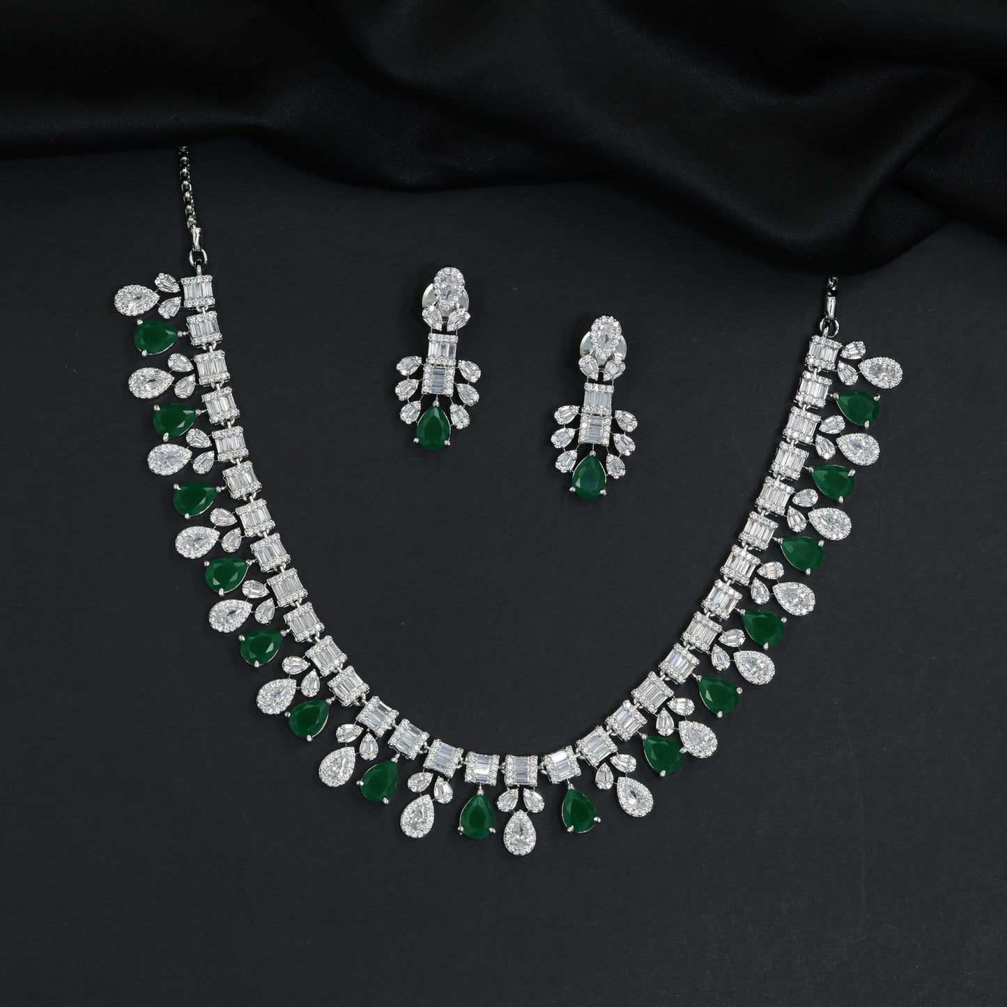 Imperial rhodium finish decorative necklace with a central cascading teardrop crest