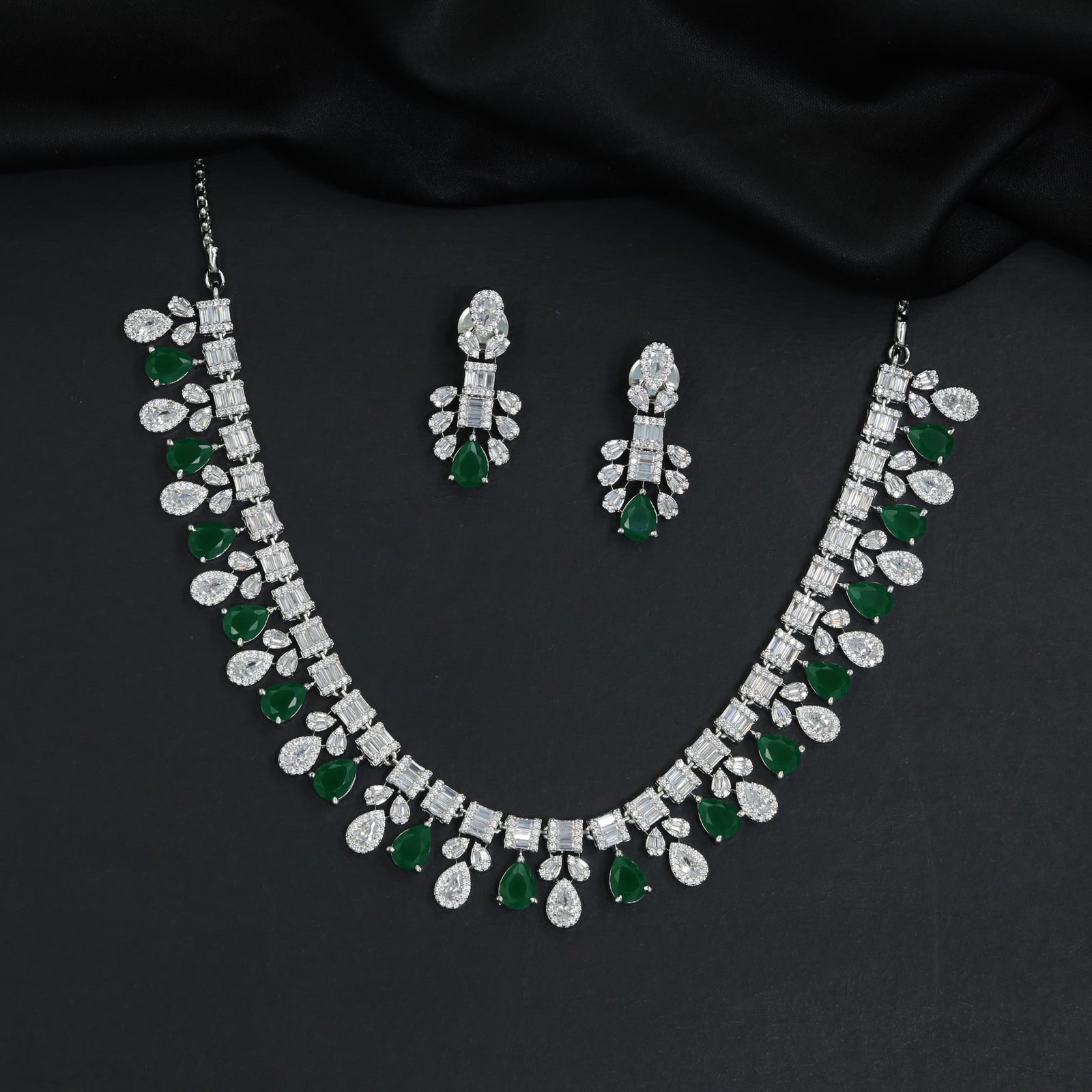 Imperial rhodium finish decorative necklace with a central cascading teardrop crest