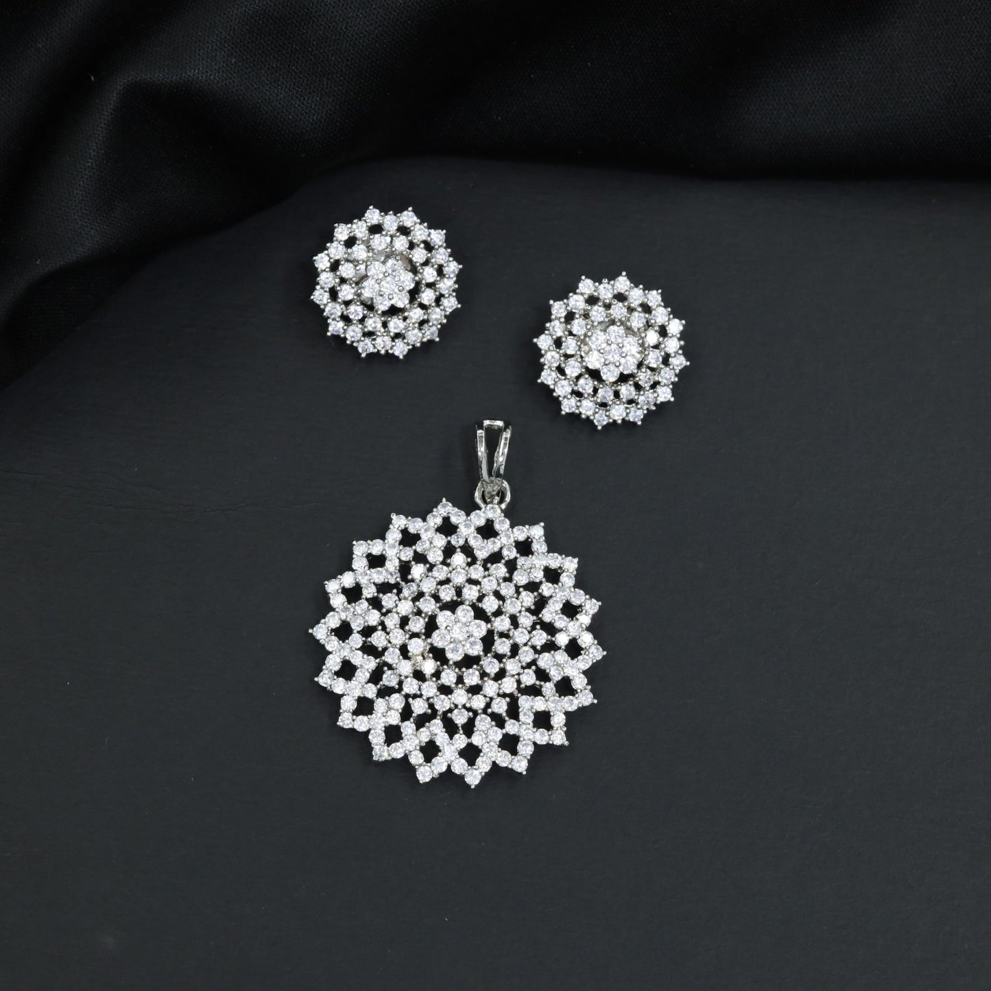 Grand pendant set framed by starburst panel borders