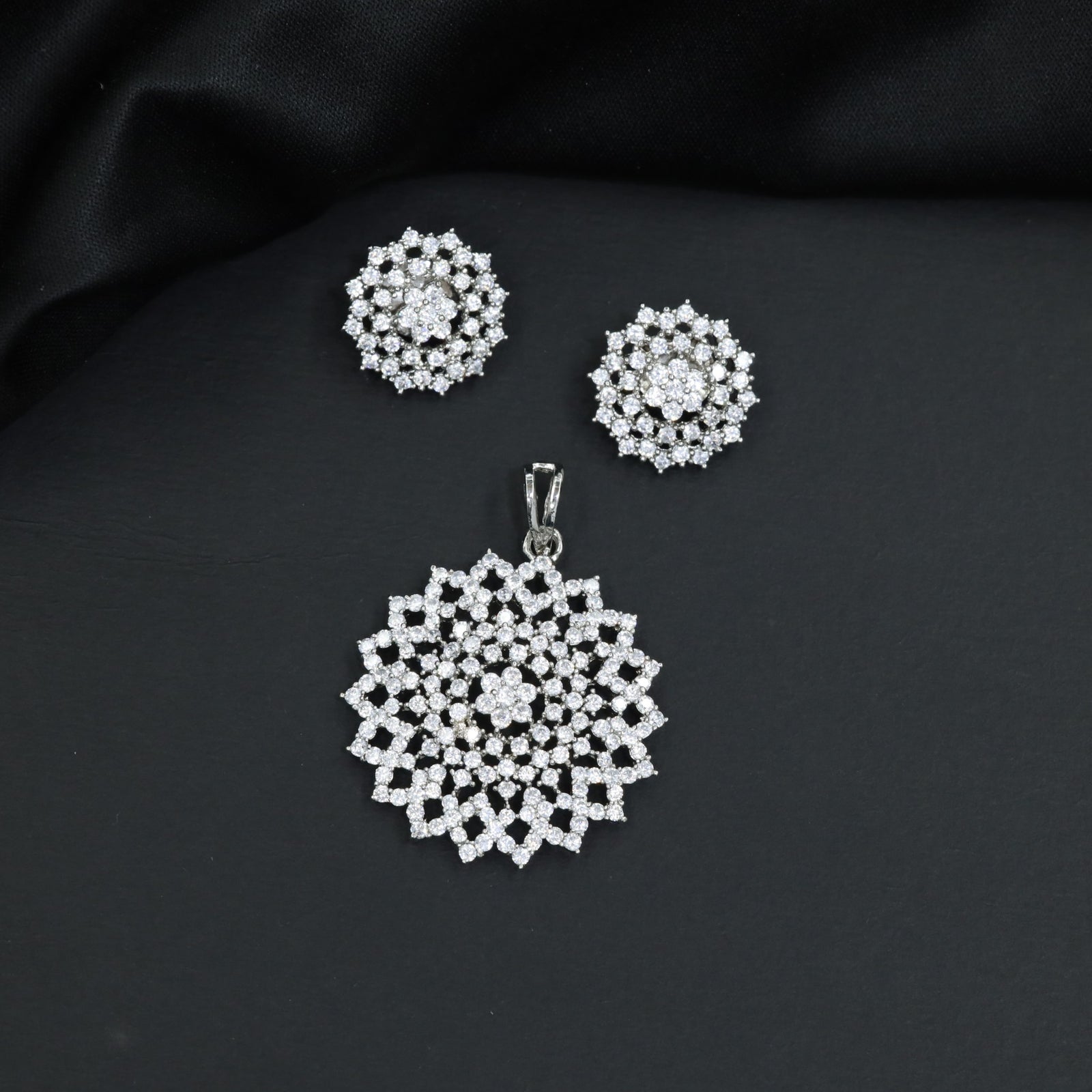 Grand pendant set framed by starburst panel borders