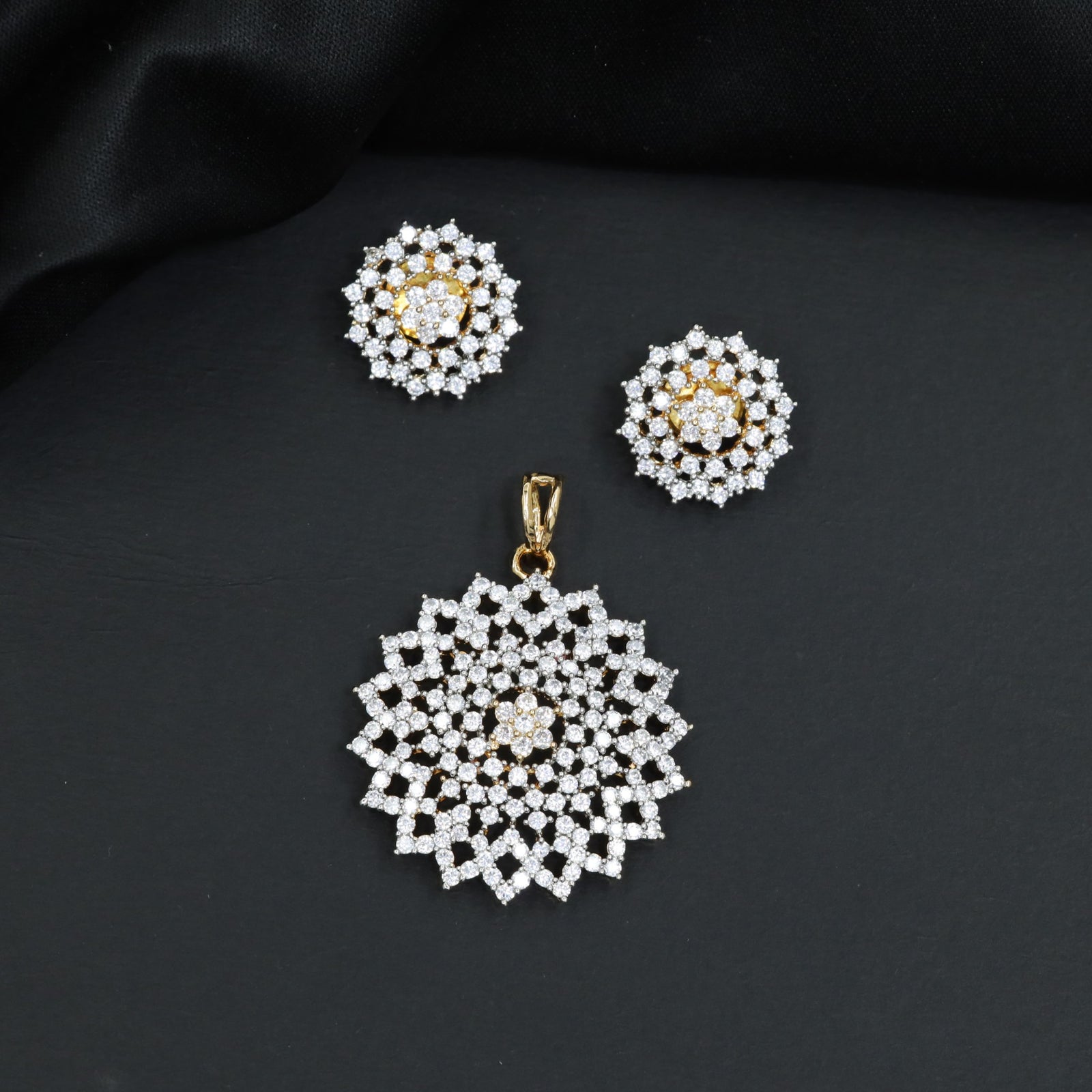 Grand pendant set framed by starburst panel borders