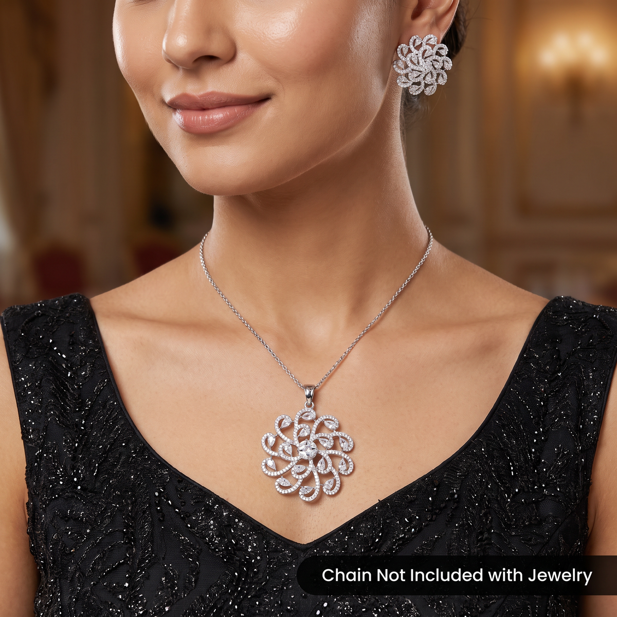 Elegant pendant set with swirling floral framework