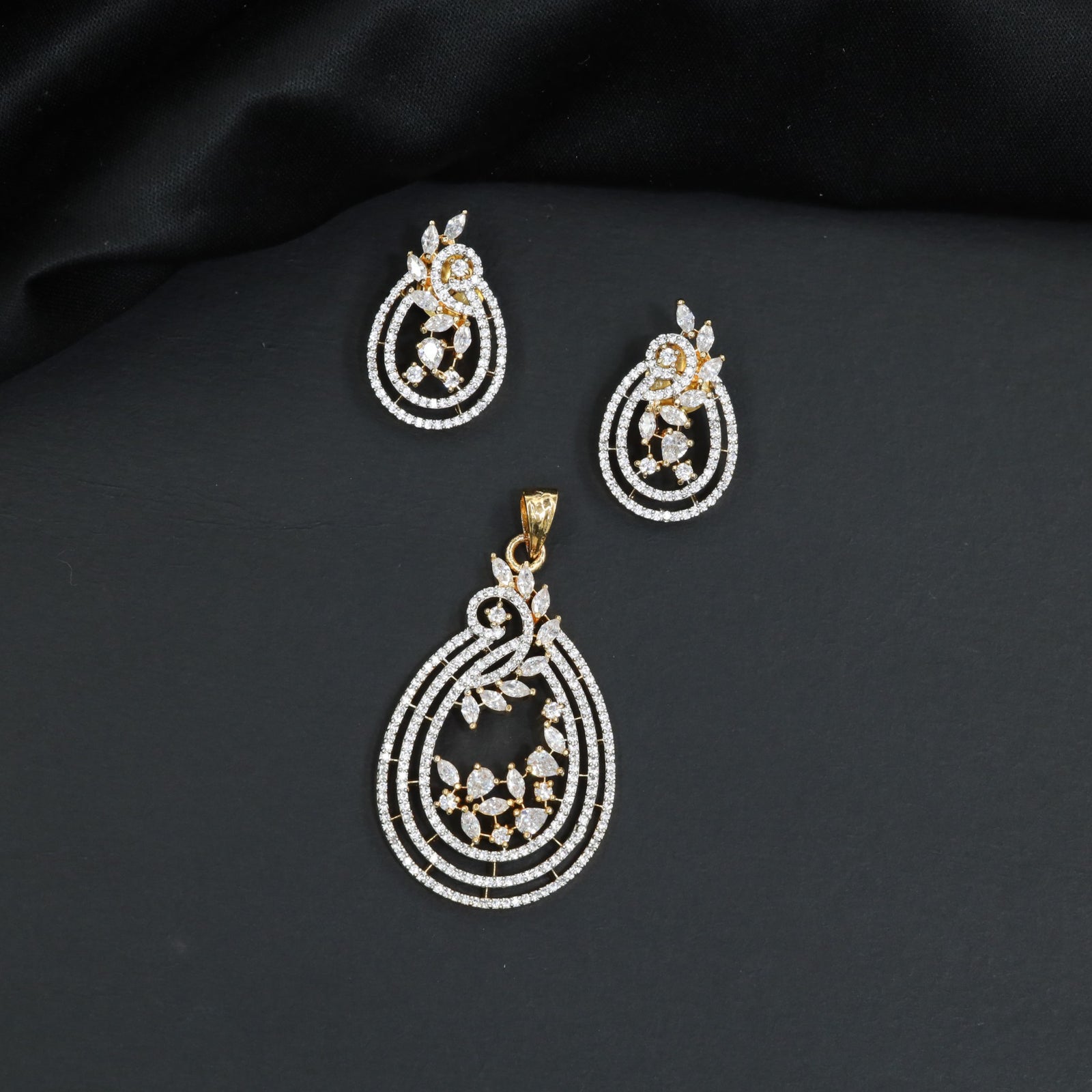 Radiant white stone tiered loop pendant set with matching small vine studs