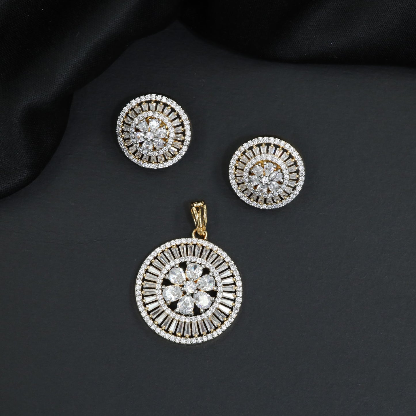 Classic rosette pendant featuring tiered baguette stone wheels and flower core