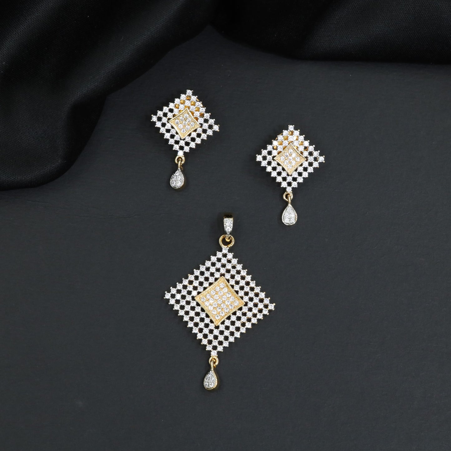 Elegant square lattice pendant set with matching stone studded jali work hanging earrings
