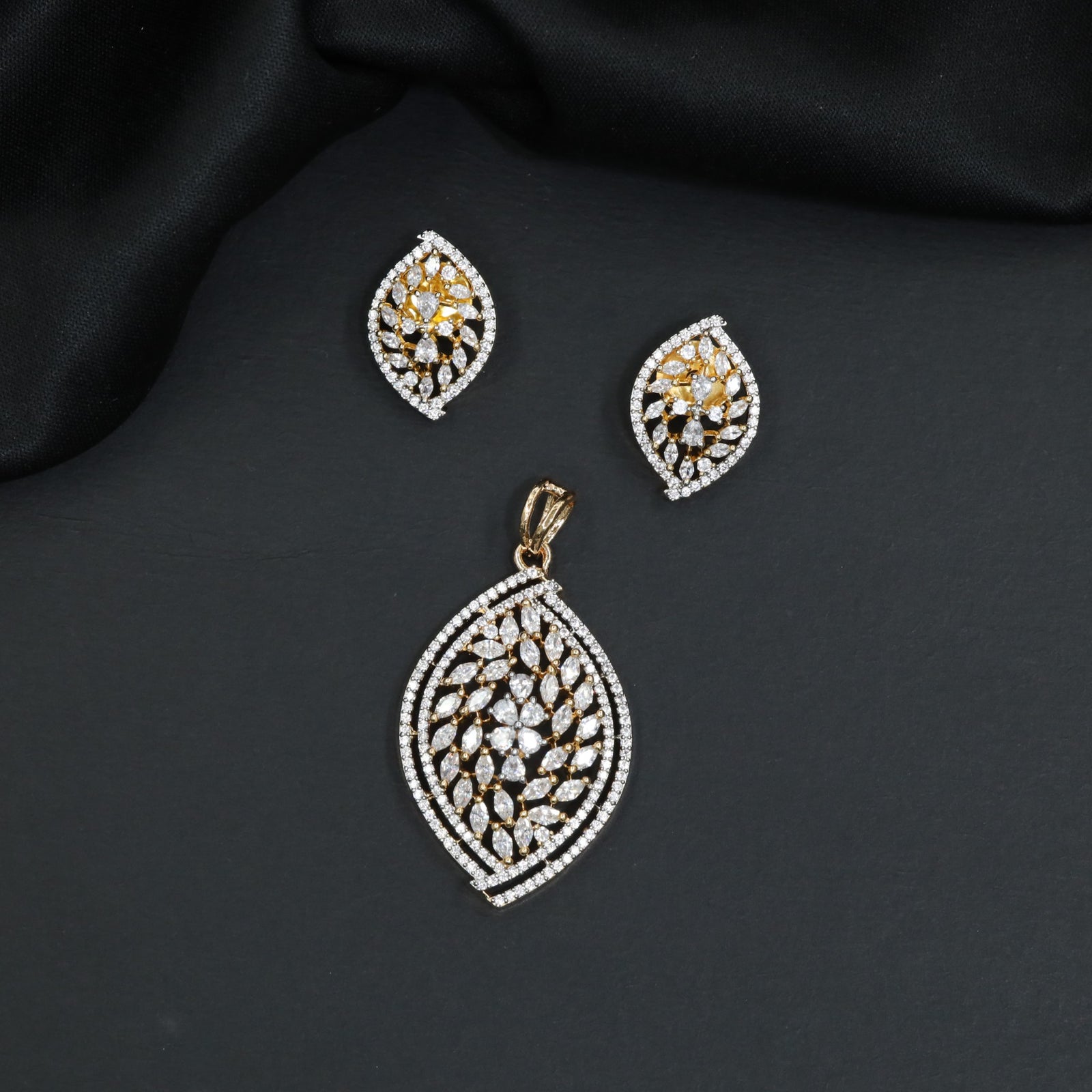 Beautiful stone studded medallion pendant set with marquise vine lattice
