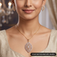 Beautiful stone studded medallion pendant set with marquise vine lattice