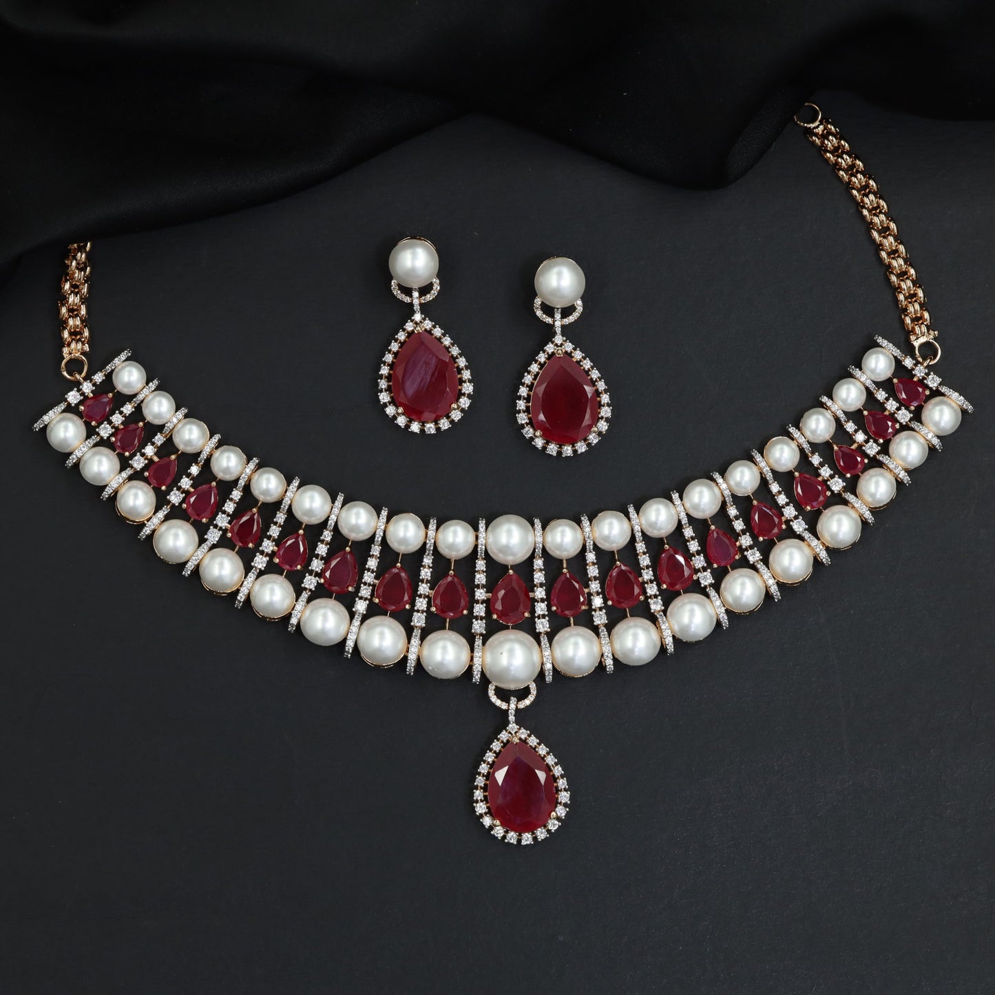 Classic royal pearl strand choker with a suspended teardrop halo pendant