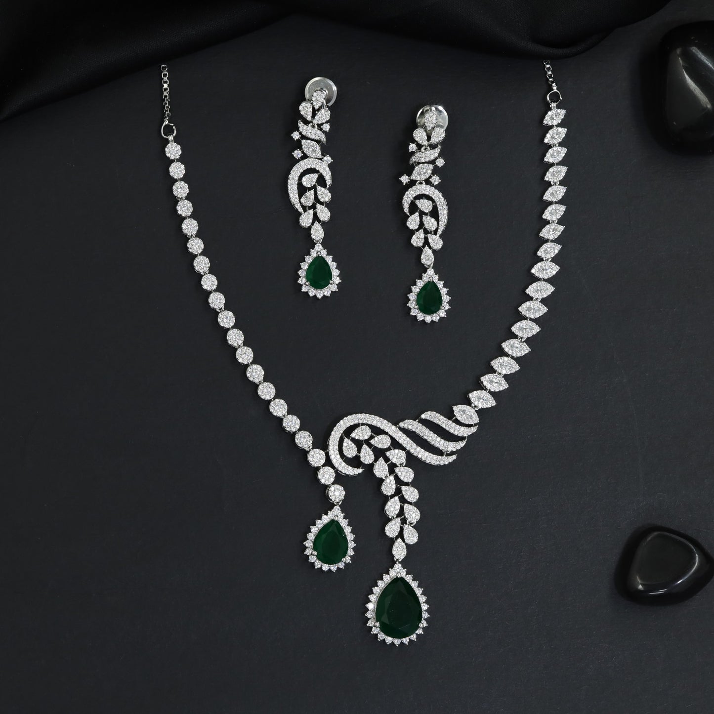 Classic asymmetrical vine motif rhodium necklace with dual teardrop pendants