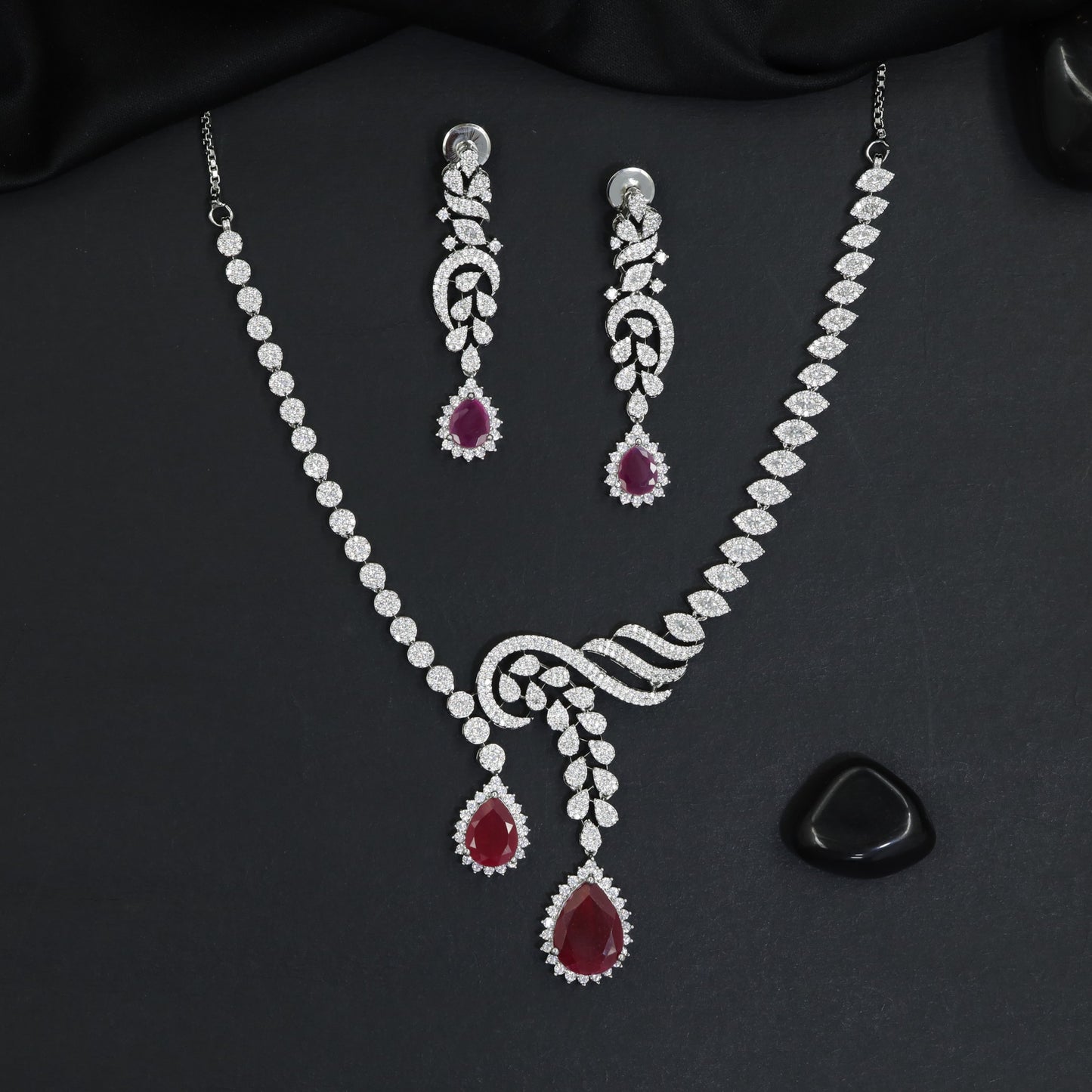 Classic asymmetrical vine motif rhodium necklace with dual teardrop pendants