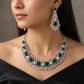 Traditional cascading marquise leaf rhodium necklace set with starburst clusters