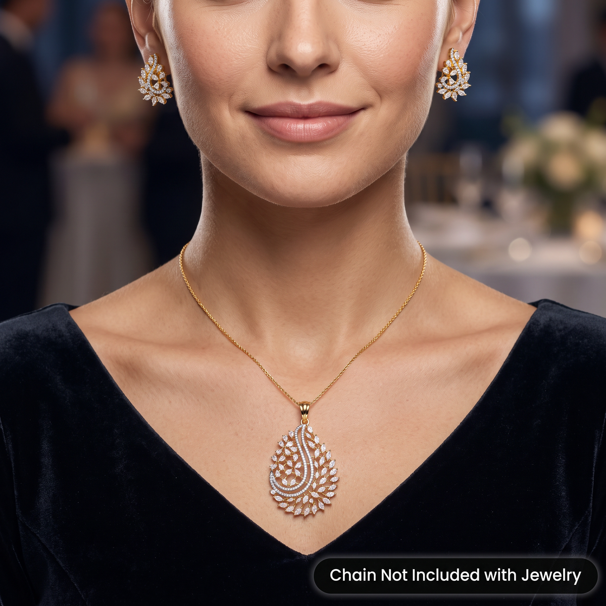 Graceful marquise stone paisley motif pendant set with stone accented top bail