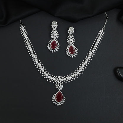 Rosette pendant rhodium necklace with double strand silhouette