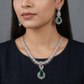 Rosette pendant rhodium necklace with double strand silhouette