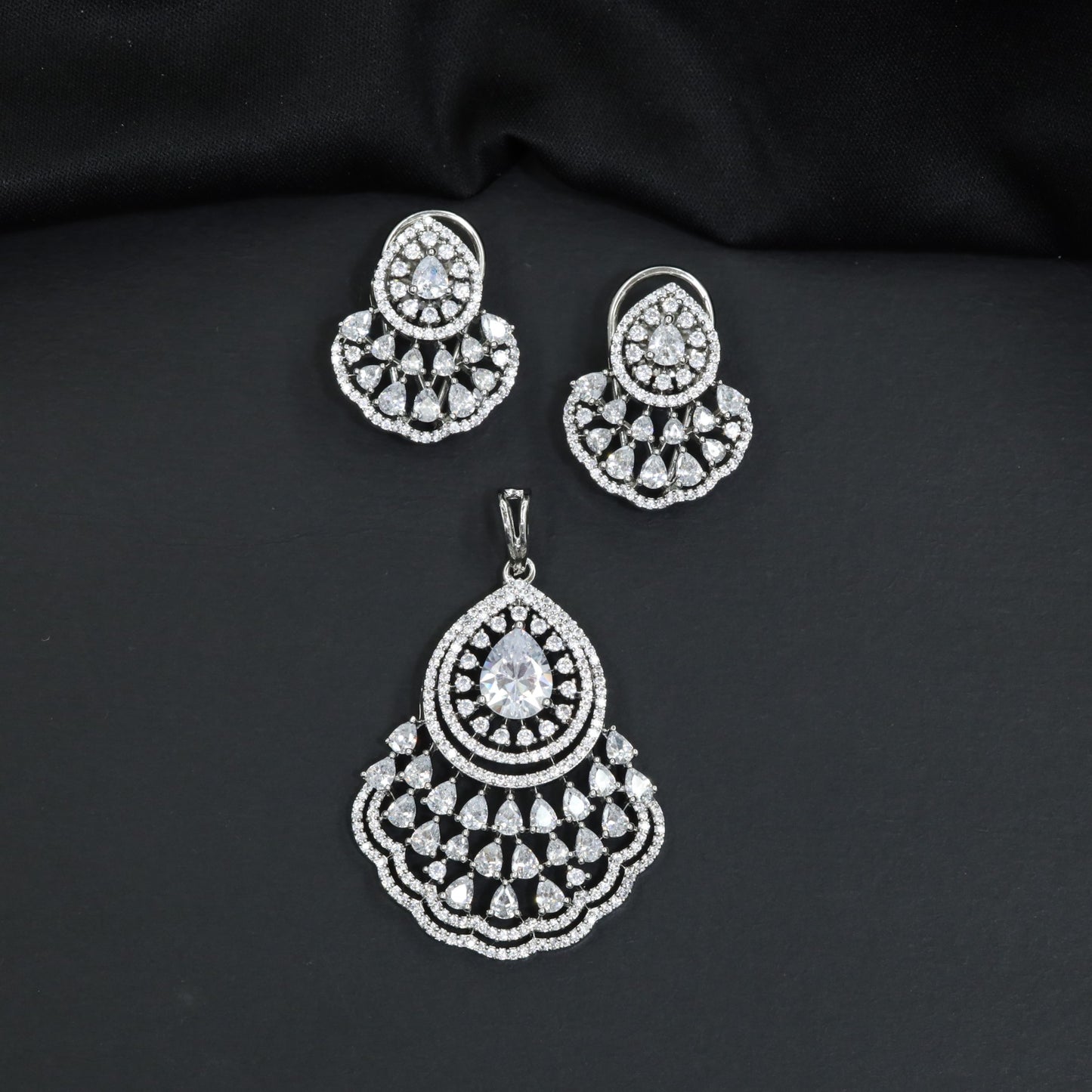 Festive Pendant Set with Teardrop Halo Design