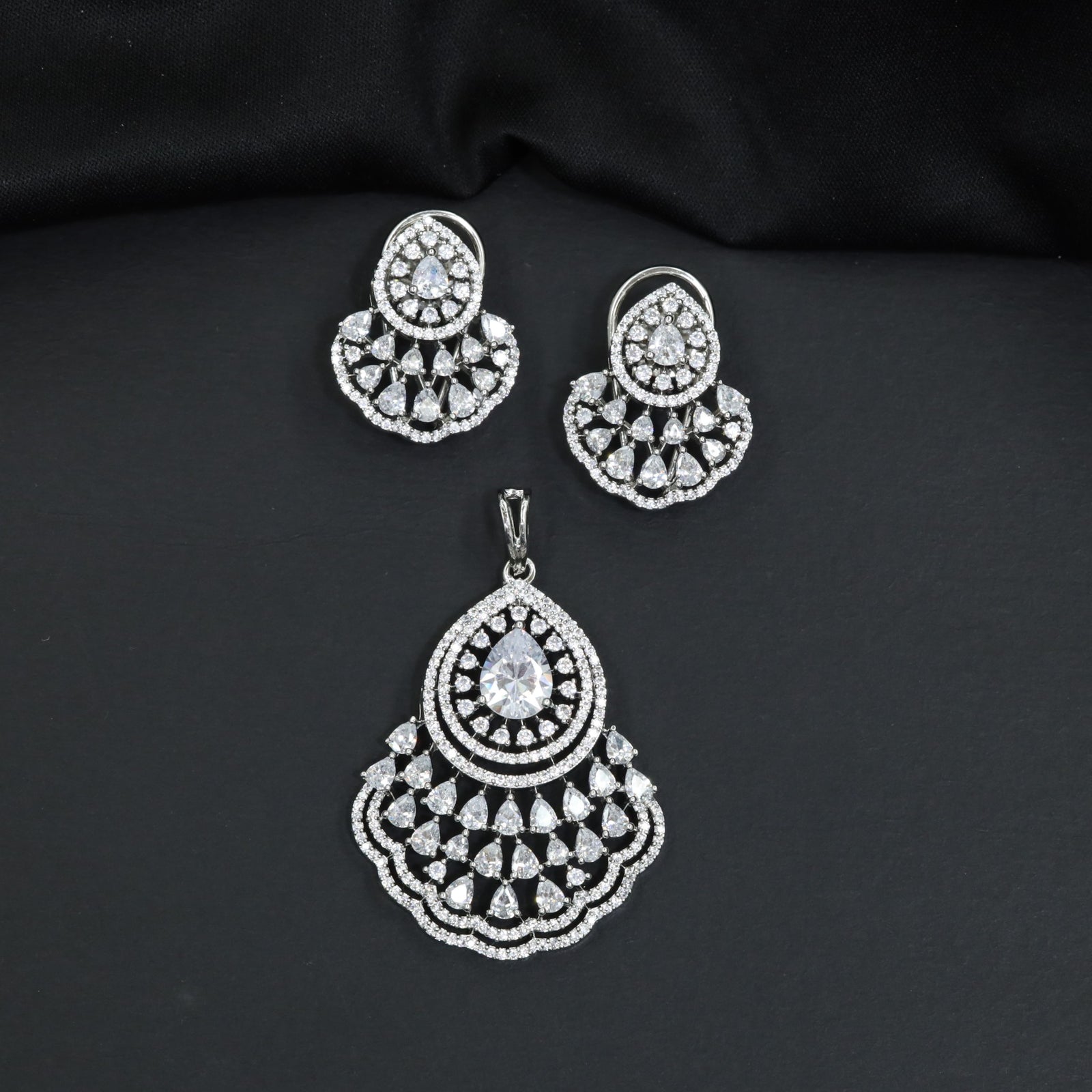 Festive Pendant Set with Teardrop Halo Design