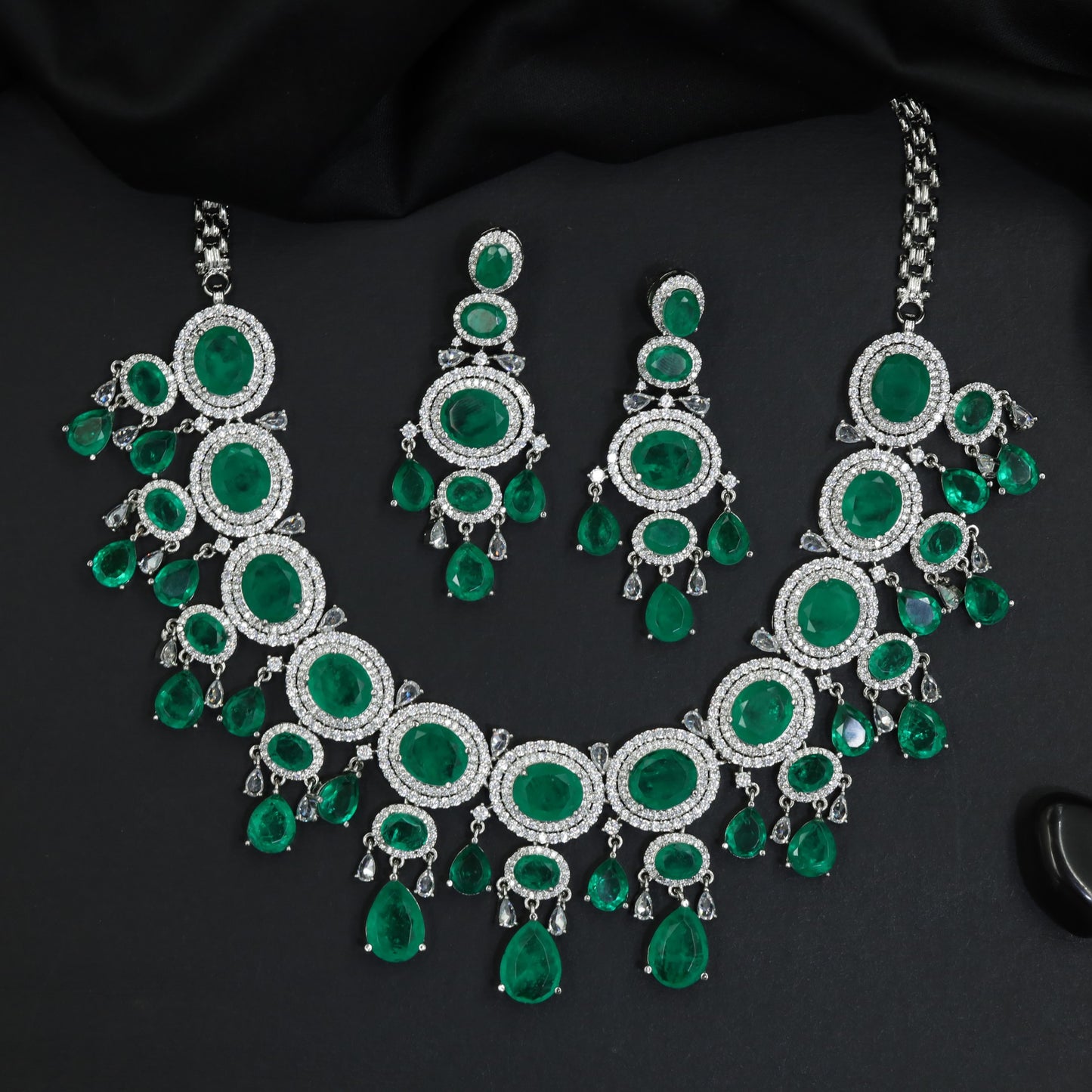 Imperial graduating layout rhodium necklace with a hanging central teardrop cluster
