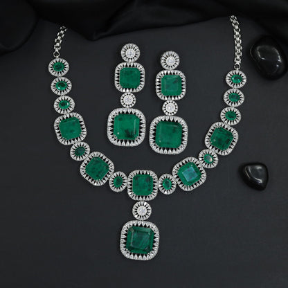 Traditional cushion plaque rhodium necklace set with a suspended square pendant